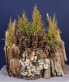 Driftwood sculpture of nature scene with pinecones